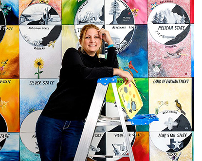 “Project 50” by Venezuelan artist Isabel Perez Salazar included 50 paintings featuring the landscape and coins from each U.S. state. (Photo by Isabel Perez Salazar) 
