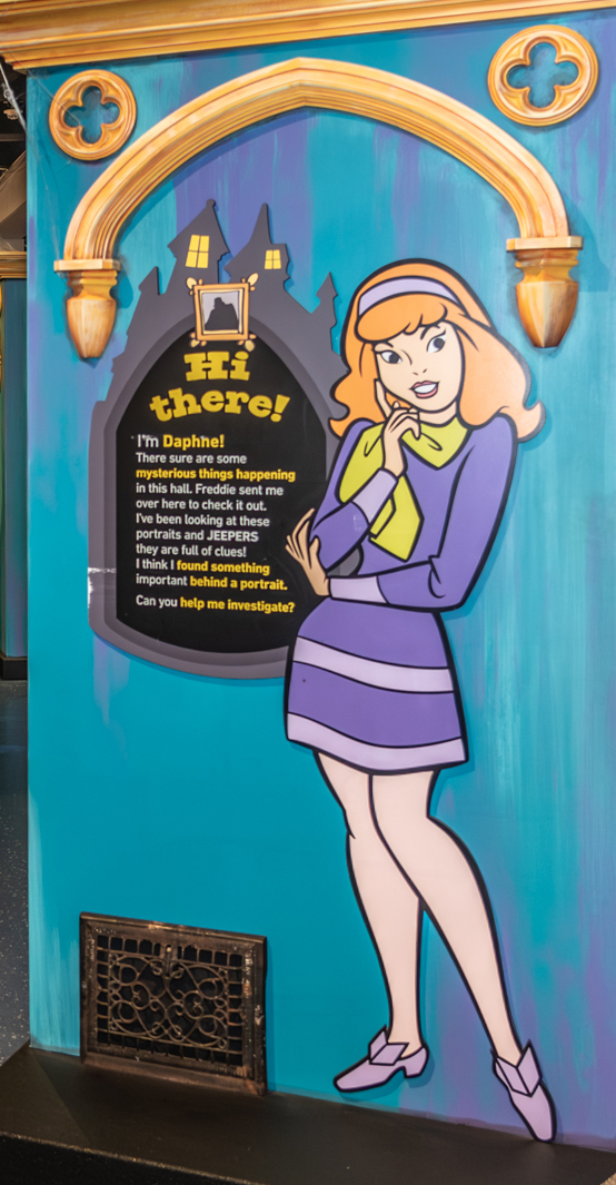 At one of the first stops in solving the “Mansion Mayhem” case, Daphne asks for help searching for clues in the hall of portraits. (Photo by Michael Murphy/The Museum of Discovery and Science)