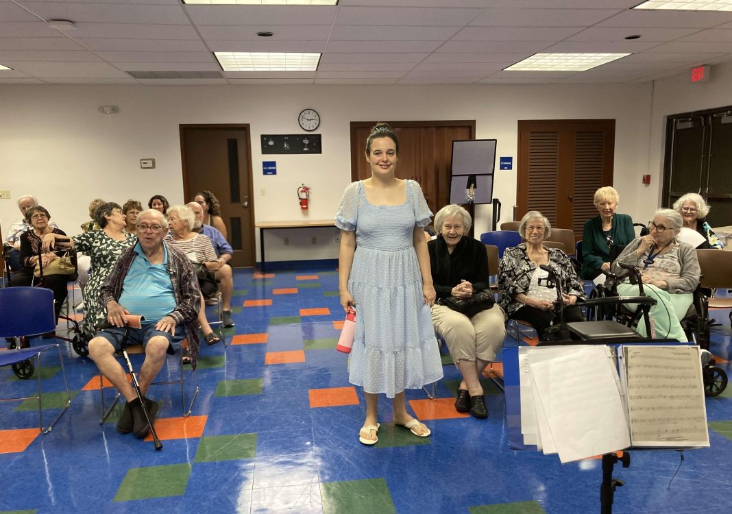 Emily Kennedy (center) before a performance at Pembroke Pines Walter C. Young Library (Photo by Barbara Kennedy, courtesy of Emily Kennedy)